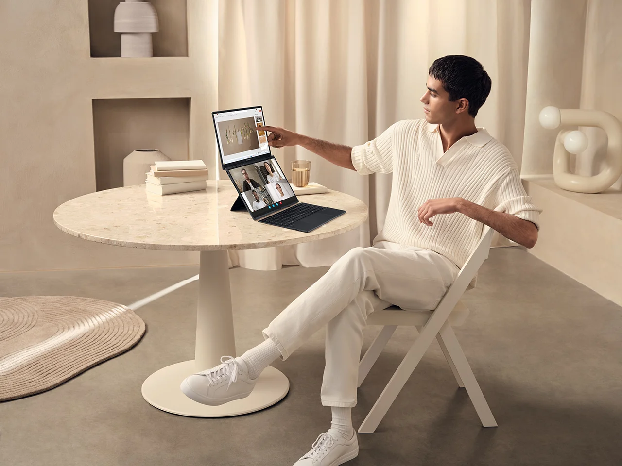 A hip CEO using an ASUS Zenbook while in a video call, highlighting its sleek design and professional remote work capabilities.