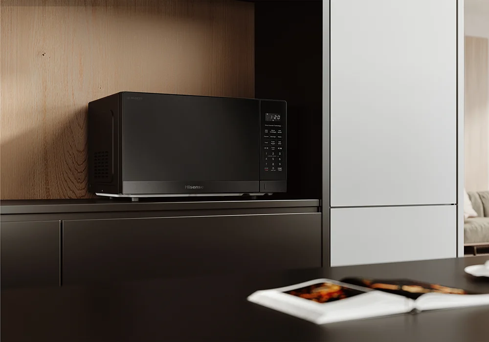 Hisense black microwave oven with digital controls in a modern kitchen - stylish countertop appliance for fast, precise cooking in New Zealand homes.