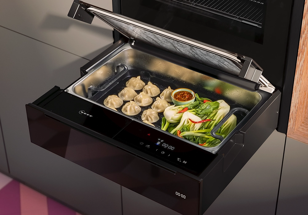 NEFF Deep Black steam drawer with dumplings and vegetables, built-in steam cooking appliance with touch controls