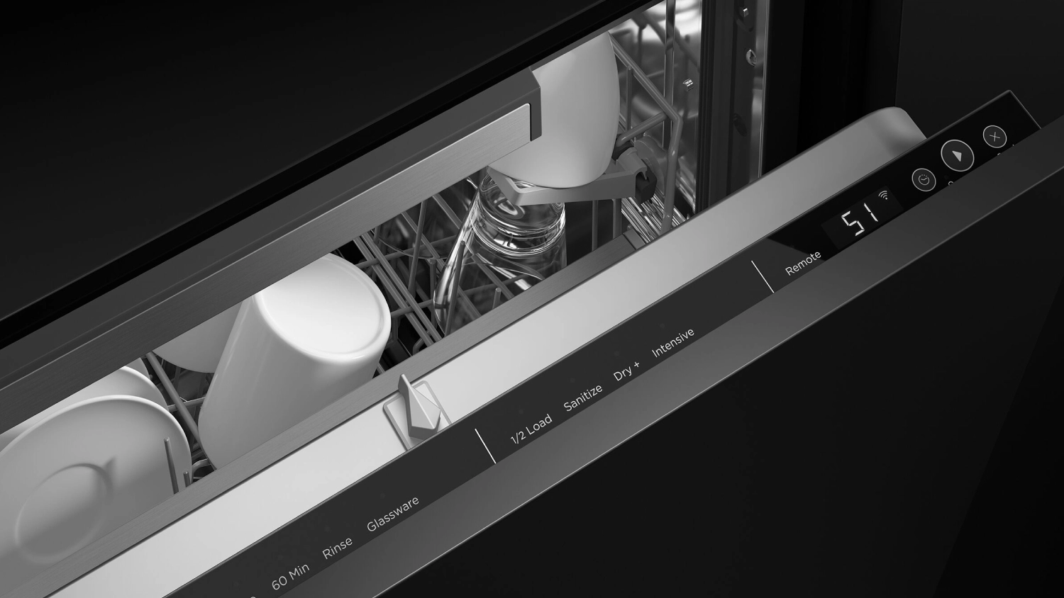 Close-up of an integrated dishwasher door partially open, showing the internal digital control panel with cycle options such as 60 Min, Rinse, Glassware, Half Load, Sanitise, Dry, and Intensive, along with an interior rack loaded with mugs, cups, a drinking glass and some plates.