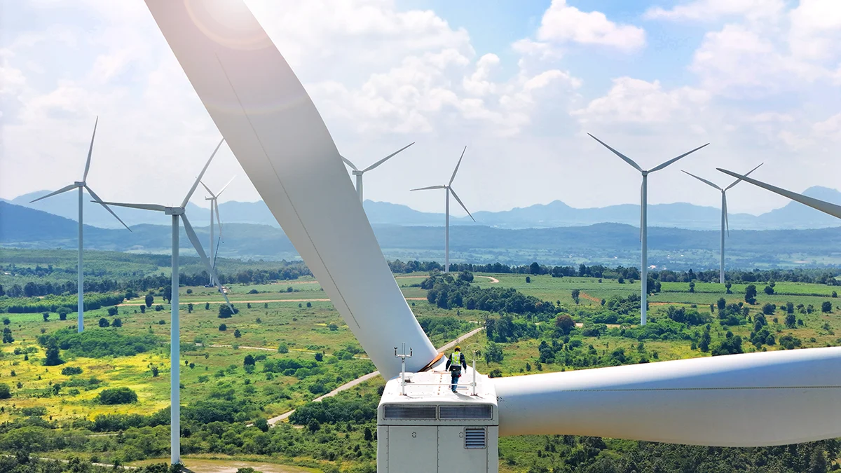 Happy mum and baby relaxing on the couch with a Panasonic heat pump running in the background.