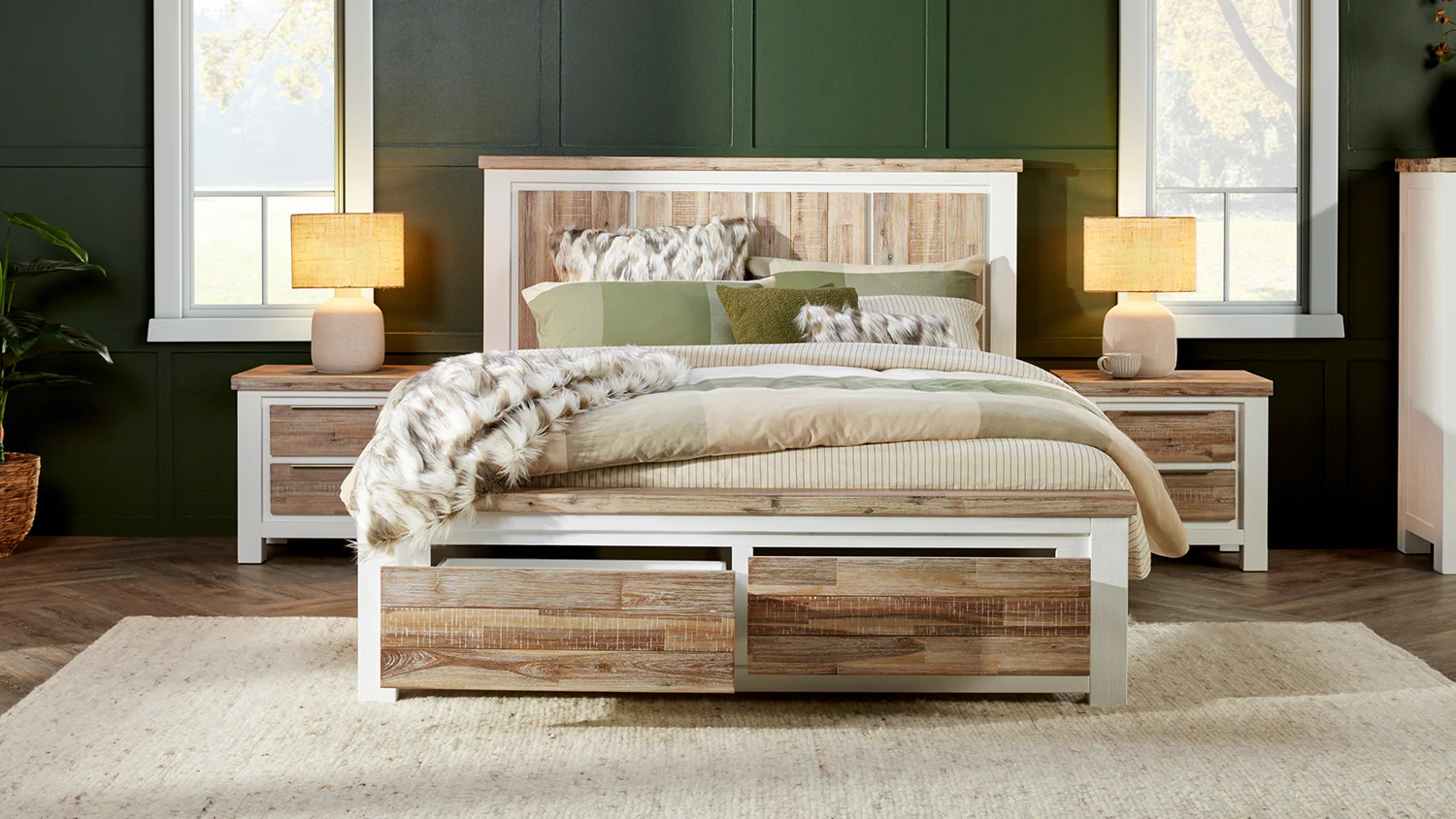 The queen-size, rustic Homestead bed frame with front drawers open, in a stylish bedroom. Matching bedside tables from the Homestead collection sit on either side of the bed, with a lovely porcelain lamp on top.
