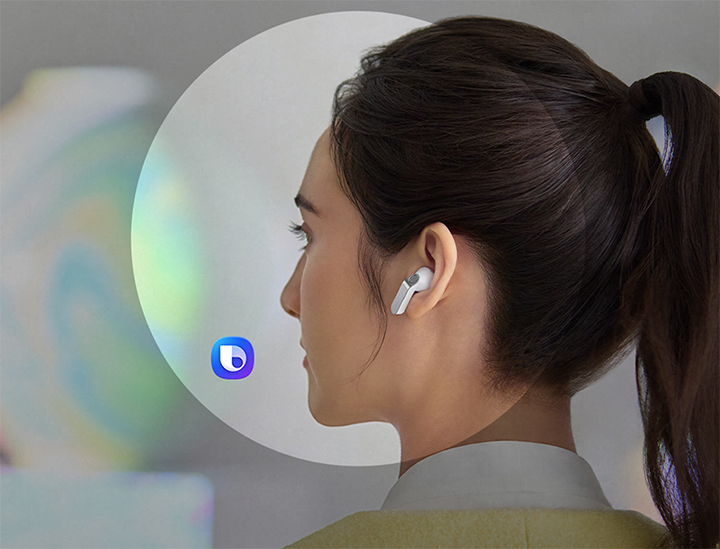 A rearview shot of a woman using a single, white Galaxy Buds4.